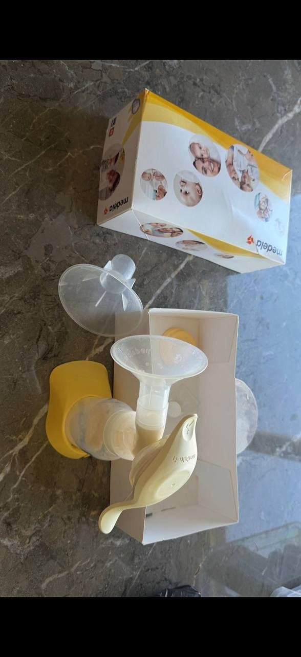 Молокоотсос Medela и слинг
