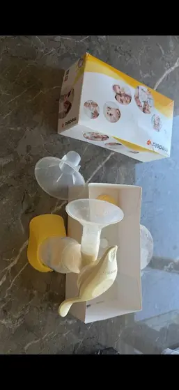 Молокоотсос Medela и слинг